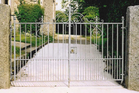 Restored Victorian gates with ornamental scroll work