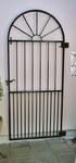 Curved top metal gate by Kevin Gerry