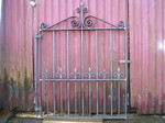 Wrought iron single gate with hand forged scrolls by Kevin Gerry