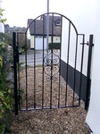 Single gate with curved top and scroll pattern by Kevin Gerry